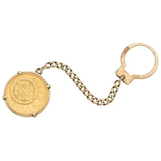 A 14K yellow gold key ring with one 21.6K yellow gold coin.