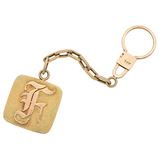 A 14K yellow gold key ring.