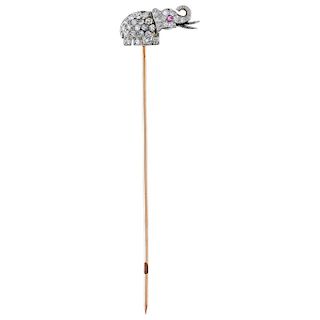 A diamond and ruby 18K rose gold and 14K white gold lapel pin.