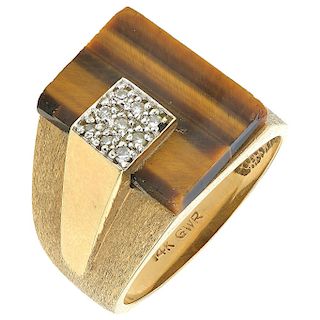 A quartz and diamond 14K yellow gold ring.