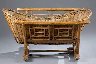 Chinese cradle, wood frame & wicker basket.
