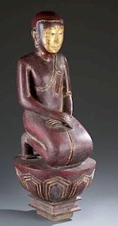 Thai carved wood kneeling monk with gilt face.