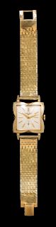 A 14 Karat Yellow Gold Wristwatch, Longines, Circa 1950's,