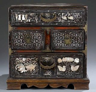 Korean 4 drawer chest with mother of pearl inlay.