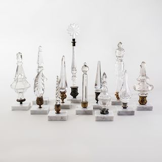 Group of Twelve Cut and Molded Glass Finials Mounted on Marble Bases
