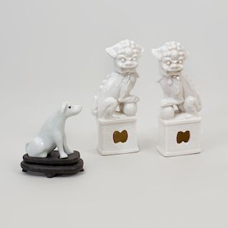 Pair of Chinese White Glazed Porcelain Models of Buddhistic Lions and a White Glazed Porcelain Model of a Hound