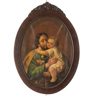 San José con niño Jesús. Óleo sobre tela. Enmarcado en madera tallada.