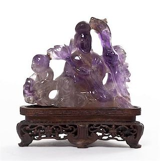 * A Chinese Carved Amethyst Figural Group, Height 2 3/4 inches.