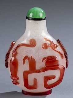 A Chinese red glass overlay snuff bottle.
