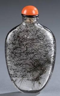 A Chinese ovoid hair crystal snuff bottle.
