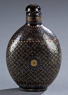A Chinese lacquered snuff bottle.