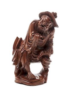 A Chinese Carved Wood Figure of a Man, Height 6 3/8 inches.