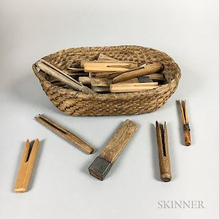 Group of Carved Wood Clothespins and a Woven Rush Basket
