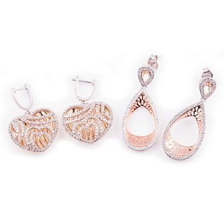 Two pairs of diamond and sterling silver earrings