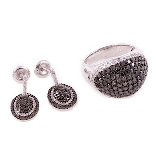 Black diamond and diamond ring and pair of earrings