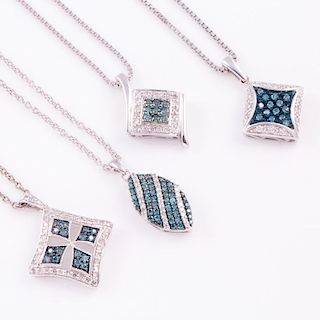 Four colored diamond and diamond pendants with chains