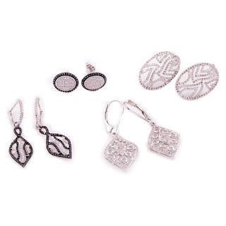 Four pairs of black diamond and diamond earrings