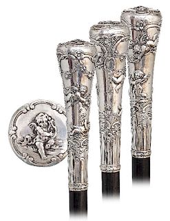 8. Silver Putti Dress Cane -Ca. 1870 -Substantial silver knob fashioned in a well-proportioned, elongated shape and finely hand chased and engraved wi