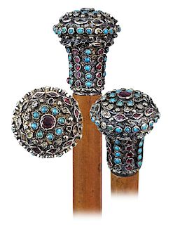 22. Silver Gilt and Jeweled Cane -Ca. 1880 -Silver gilt knob fashioned in a classic Milord shape and entirely studded with individually raised set tur