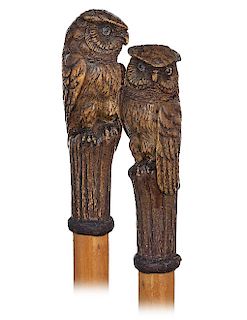26. Owl Cane -Ca. 1900 -Very large pearwood handle carved to depict an owl perched atop of a wood stem, rarely encountered boxwood shaft with a braide