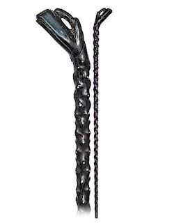 38. Black Coral Cane -Ca. 1890 -The handle is fashioned of a giant, single piece of black coral and flush grafted on a real coromandel wood shaft with