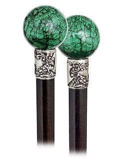 39. Hard Stone Dress Cane -Ca. 1900 -A sizeable malachite ball knob and its silver collar with two lions supporting a blank shield struck with a “J.M”