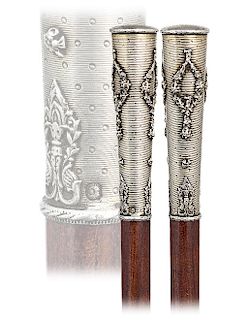 60. Silver “Cazal” Dress Cane -Ca. 1890 -Long and tapering silver cane handle totally engine turned with dots on a wavy background and embellished wit