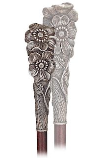 106. Art Nouveau Silver Dress Cane -Ca. 1900 -Long and tapering silver knob with three bundled dog-roses, rosewood shaft and a horn ferrule. The compo