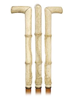 115. Bone Dress Cane -Ca. 1870 -L-shaped bone handle with an impressively tall three tiers vertical stem carved with a knotted rope and two tassels, s