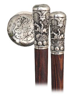 121. Silver Horse Jumping Knob -Ca. 1880 -Elongated silver knob finely hand chased and engraved with two different obstacle riding panels framed on on