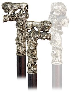 127. Knobkerrie Lion and Snake Cane -Dated 1891 -L-shaped white metal handle finely modeled, cast and chased to depict a lion and a snake and an ebony