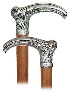 133. Silver Art Nouveau Cane -Dated 1903 -Singular, high-end silver handle modeled in the shape of a dried bough with a different flower and leave com
