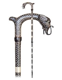 138. Rajasthan Cane -20th Century -All steel silver damascene cane with a substantially modified figural Derby shaped handle ending with an elephant h
