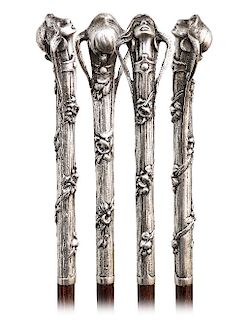 148. Silver Art Nouveau Cane -Ca. 1900 -Long and vertical silver handle modeled, cast and finely hand chased with a stylized female head on a stretchi