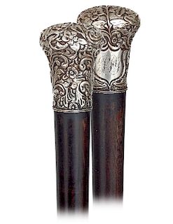 152. Silver Dress Cane -Ca. 1880 -Substantial and well-proportioned silver knob hand chased and engraved with flowers and scrolls as well as an escutc