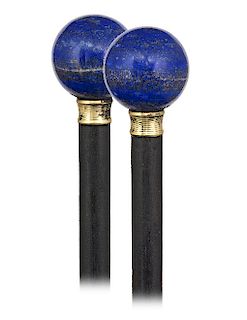 153. Lapis Lazuli Dress Cane -Ca. 1900 -Plain Lapis Lazuli ball knob and its turned and gilt collar on an ebony shaft with a metal ferrule. The blue c