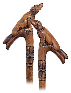 154. Folk Art Dog Cane -Ca. 1900 -Fashioned of a single hardwood branch with a T-shaped handle naturally grown at an inclined angle and carved to depi