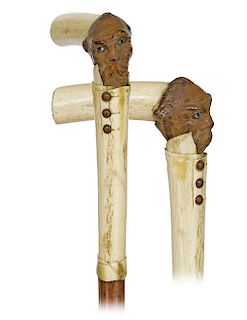 156. Bone and Coquilla nut Figural Cane -Ca. 1880 -L-shaped bone handle with a carved coquilla nut head with a split beard and two colored glass eyes 