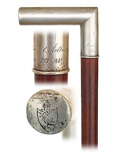 181. Silver Presentation Cane -Dated 1898/1900 -Plain L-shaped silver handle discreetly engraved on the front with a Student coat of arms and on the n
