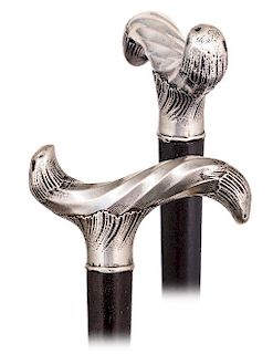 192. Silver Dress Cane -Ca. 1890 -Derby shaped silver handle with elaborate Neo-Baroque decoration, rosewood shaft and a horn ferrule. The handle is a