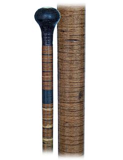 193. Paper Washer Cane -Ca. 1890 -Entirely made of paper washers tightly stacked on a steel core with an integral knob and brass ferrule. This cane is