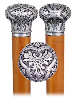 79. Silver Day Dane -Ca. 1890 -Classic and well-proportioned silver knob hand chased and engraved with repeating foliate panels on the side and the ma