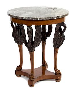 An Empire Style Parcel Ebonized Side Table Height 28 x diameter of top 23 inches.