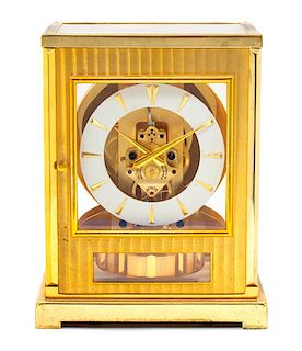 A LeCoultre Brass and Glass Atmos Clock Height 7 inches.