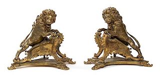A Pair of French Gilt Bronze Figural Chenets and Fire Fender Height of chenets 15 inches.