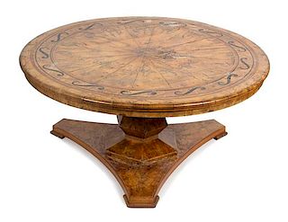 A Regency Style Marquetry Center Table Height 30 x diameter of top 64 inches.