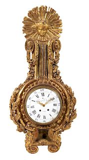 A Louis XVI Giltwood Cartel Clock Height 50 inches.