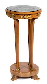 An Empire Style Gilt Metal Mounted Mahogany Pedestal Table Height 32 inches.