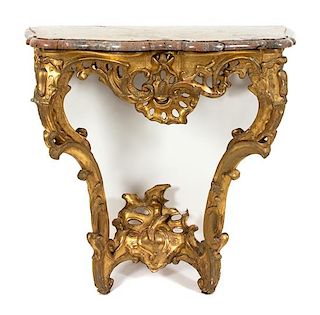 An Italian Rococo Style Carved Giltwood Marble Top Console Table Height 32 1/2 x width 32 x depth 17 1/2 inches.