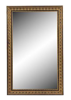 A Neoclassical Style Gilt Metal and Ebonized Mirror Height 63 x width 39 1/2 inches.